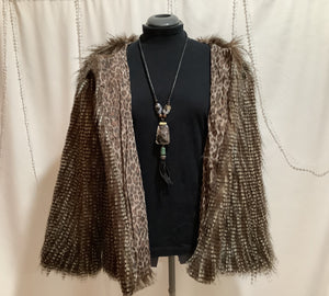 Faux owl feather jacket with coordinating boot toppers is fashion forward and animal rights friendly.