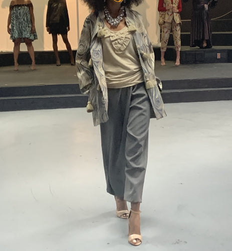 Unlined jacket/coat with grey asymmetric  pleated-pants outfit.