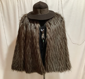 Faux owl feather jacket with coordinating boot toppers is fashion forward and animal rights friendly.